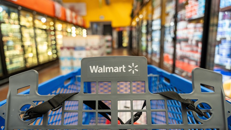 Shopping cart with Walmart logo in frozen food aisle