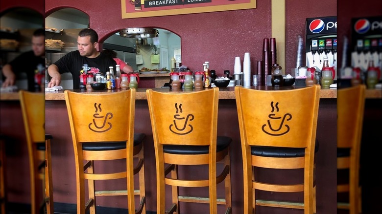 three chairs at a breakfast bar