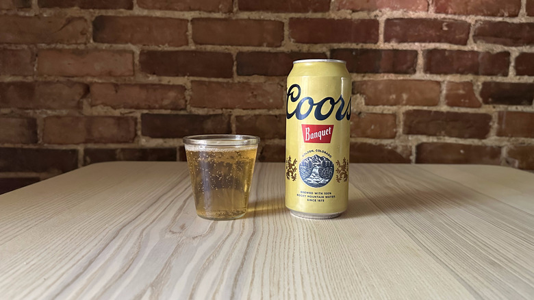 Coors Banquet beer in small glass on table