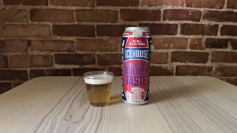 Icehouse beer in small glass on table