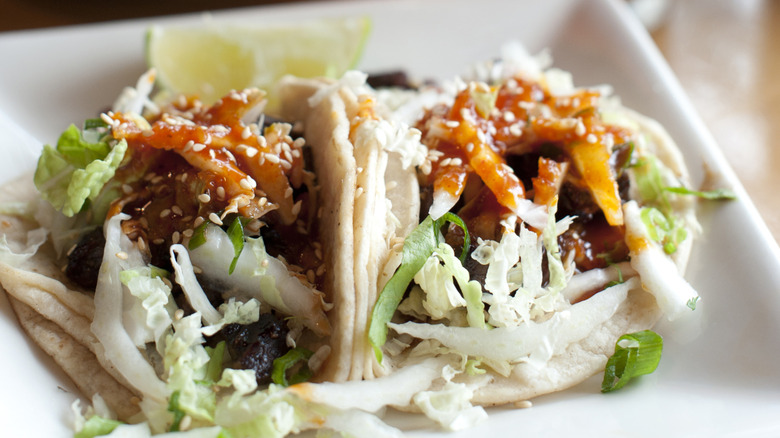 Korean tacos on a white plate