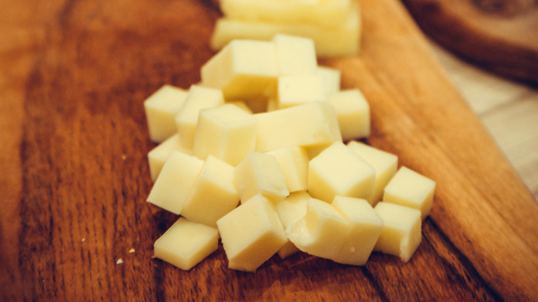 Monterey Jack cheese on a wooden cutting board