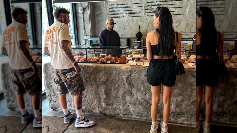 People getting pastries and coffee at the counter at Libertino Cafe