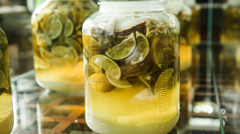 High angle close-up view of preserved lemon water with salt and sugar.
