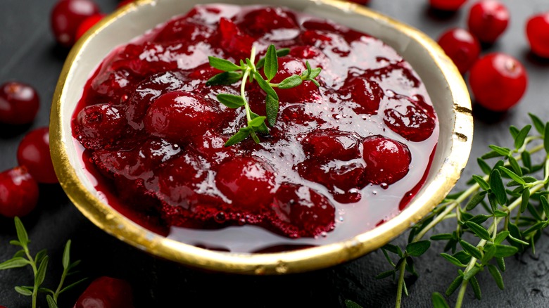 Bowl of cranberry sauce with thyme