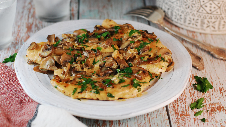 Plate of chicken Marsala with fresh parsley