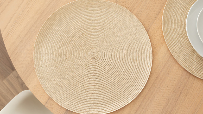 Minimalist circular placemat on wooden table