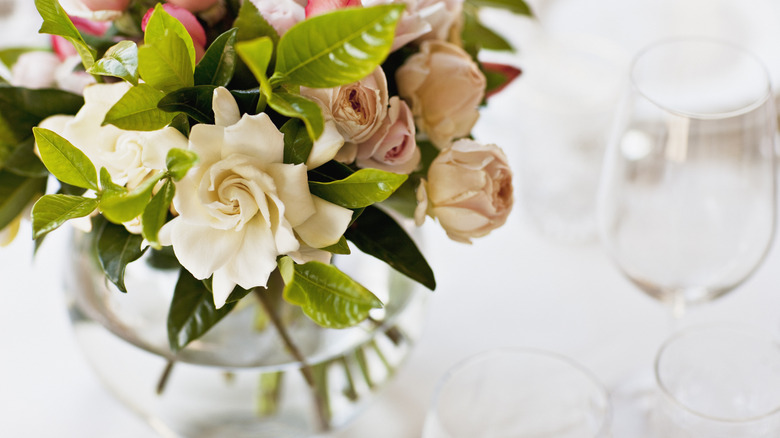 Close-up of floral centerpiece on a white table