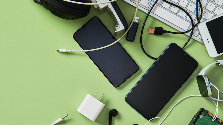Several electronic gadgets on a green background