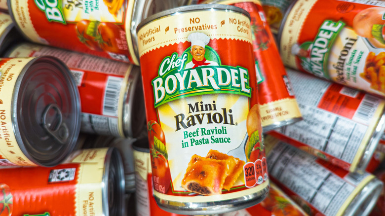 Several cans of ravioli piled together