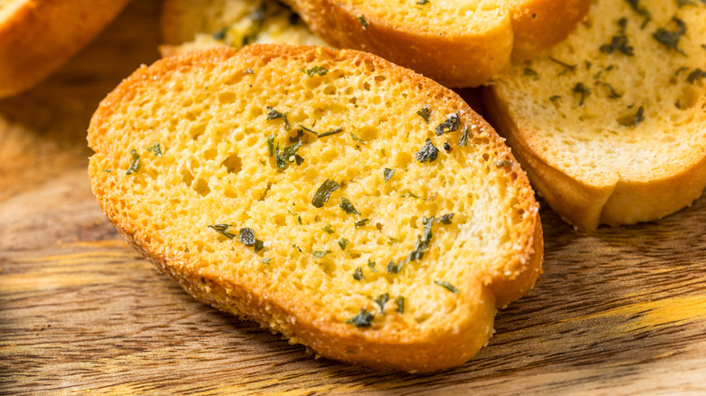 Slice of buttery garlic baguette