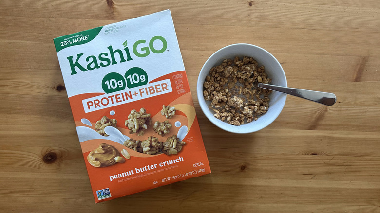 Kashi Go Protein and Fiber Peanut Butter Crunch in white bowl on wooden table