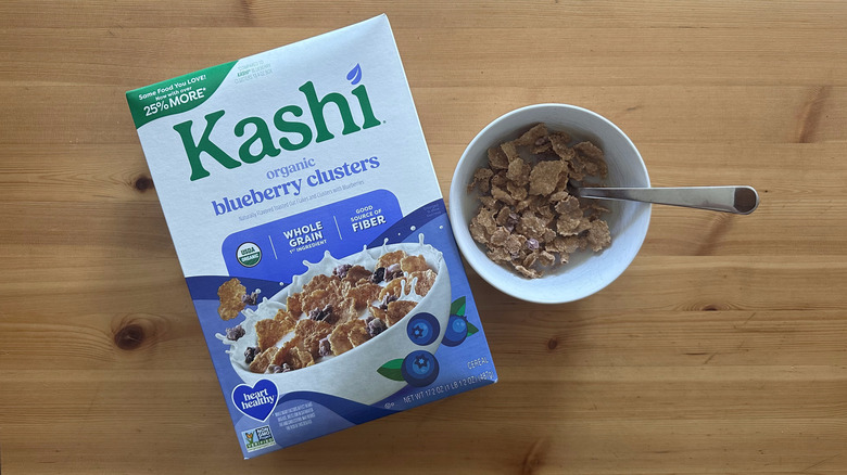 Kashi Organic Blueberry Clusters in white bowl on wooden table