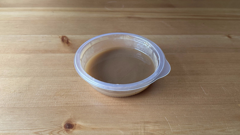 KFC gravy on wooden table