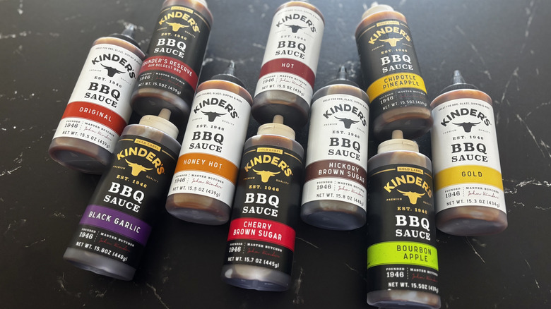 Various Kinder's BBQ sauce bottles on countertop