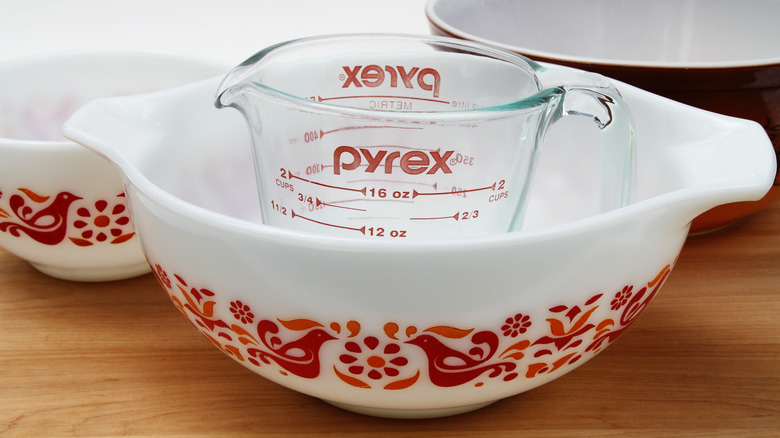Glass Pyrex measuring cup in vintage Pyrex bowl