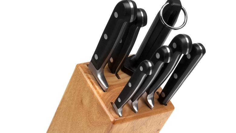 Wooden knife block isolated against a white background