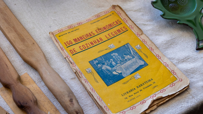 Old vintage cookbook placed on table