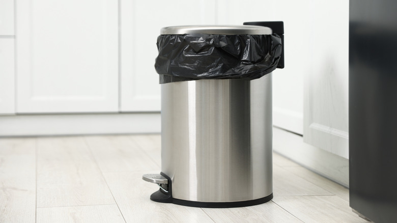 Metal trash can in kitchen