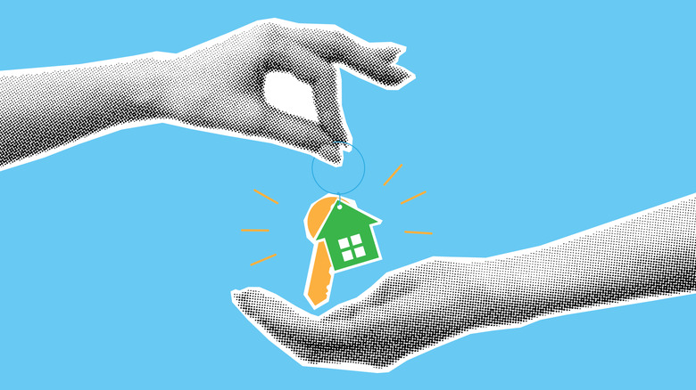 A pair of hands handing over keys against a blue background