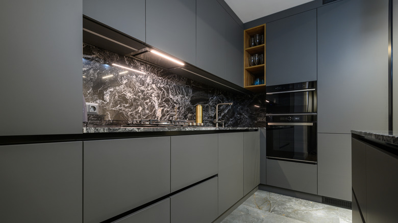 Luxury gray kitchen with monochromatic cabinets and flooring