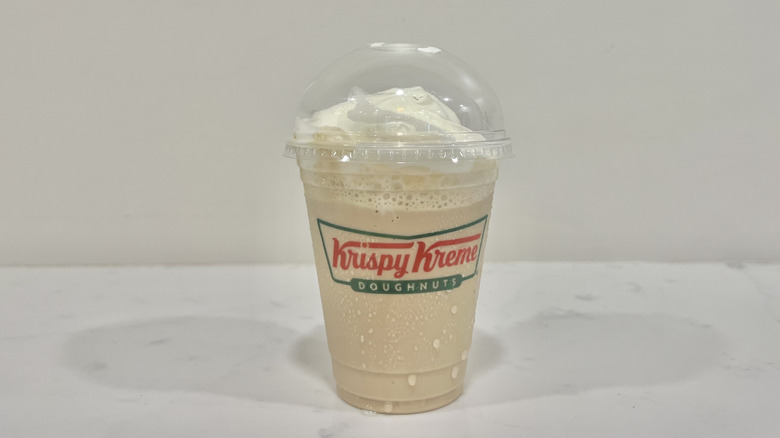 Krispy Kreme frozen specialty latte in to-go cup.