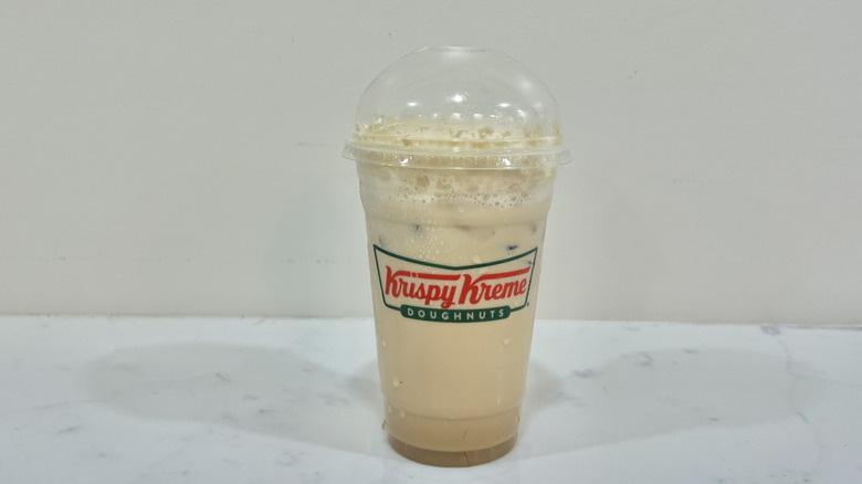 Krispy Kreme iced vanilla latte in to-go cup.
