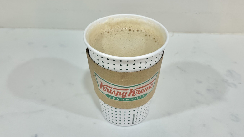 Krispy Kreme cappuccino in to-go cup.