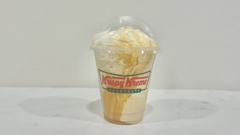 Krispy Kreme frozen caramel mocha specialty latte in to-go cup.