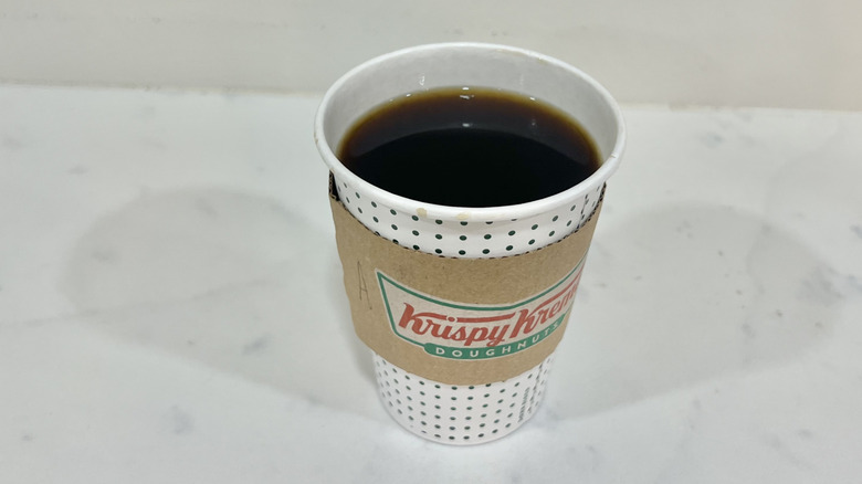 Krispy Kreme Americano in to-go cup.