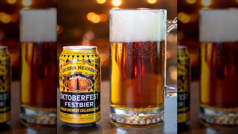 Can of Sierra Nevada Festbier next to a mug of beer.