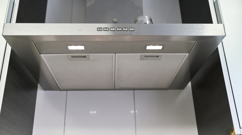 Detail shot of a stainless-steel kitchen range hood