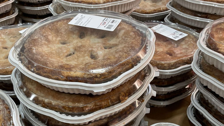 Costco apple pies stacked in plastic containers