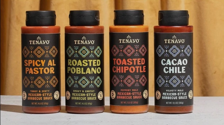 Four Tenayo sauces on white table, yellow background behind