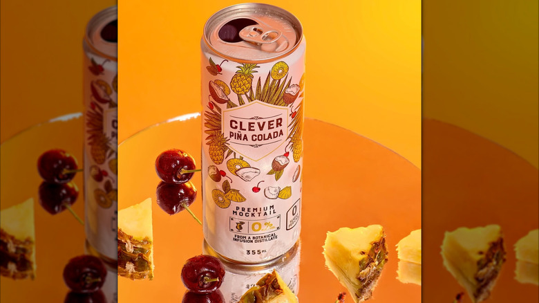 can of pineapple mocktail from Clever with cherries and pineapple chunks on the side