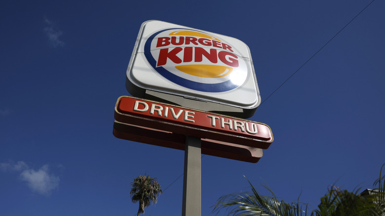 Burger King sign against blue sky
