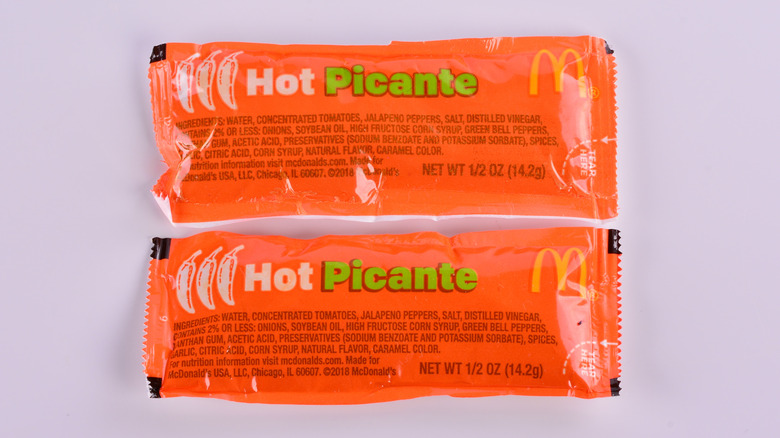 Two packets of McDonald's Hot Picante sauce