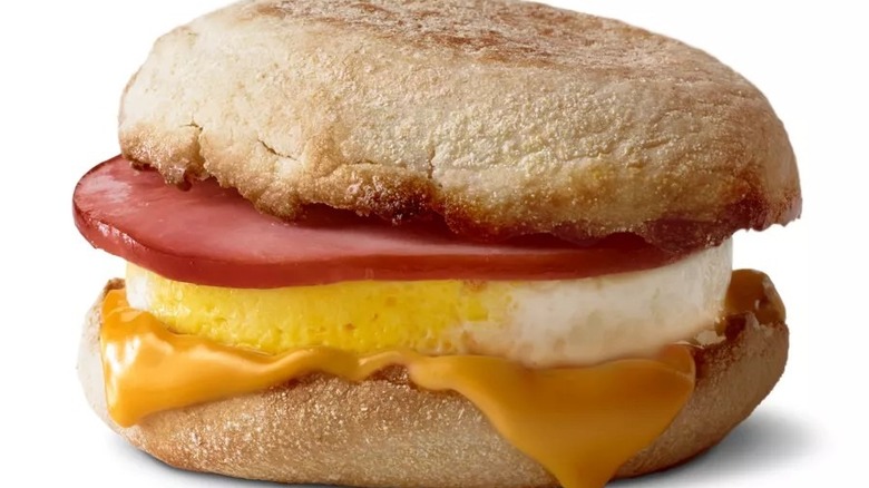 Close up of McDonald's bacon and egg McMuffin on white background