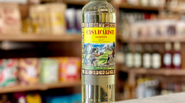 Close-up of Casa D'Aristi Xtabentun label against blurry background.