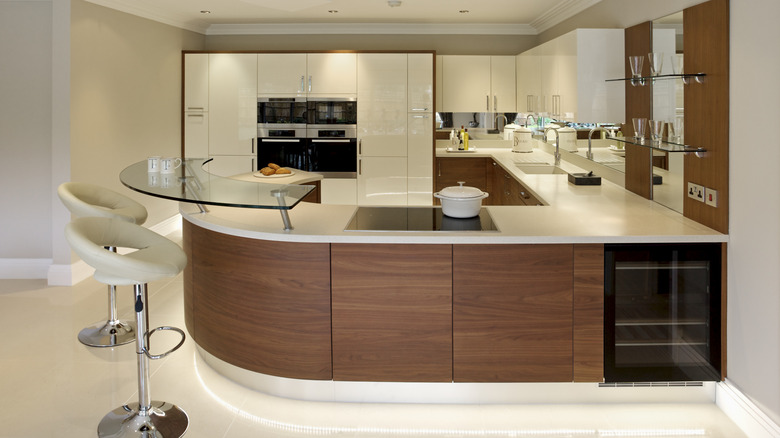 A modern kitchen with a curved countertop