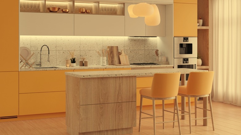 Cabinets painted gold in kitchen