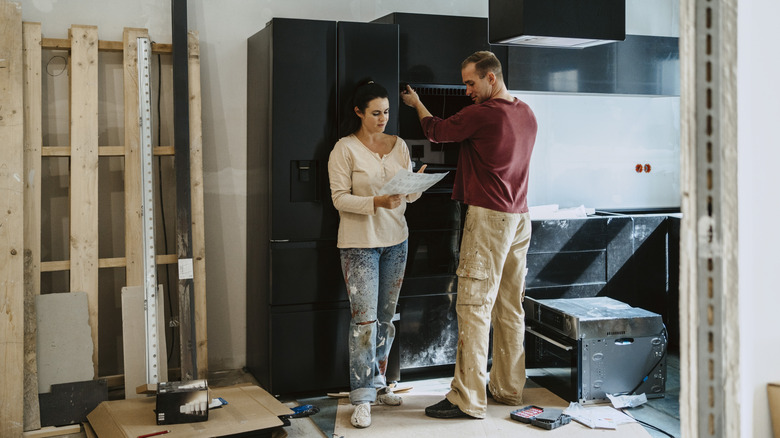 A couple remodeling their kitchen