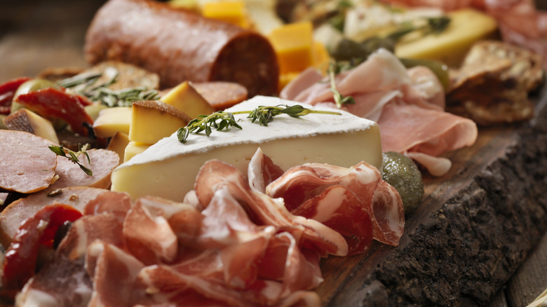 Charcuterie board with lots of meat up close
