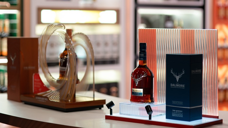 Two bottles of Dalmore whisky presented in a store, highlighting a whiskey with fancy packaging