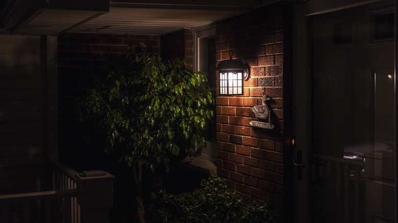 Porch light on in front of residential home