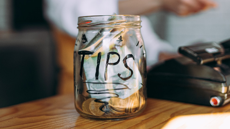 Tip jar on wooden countertop