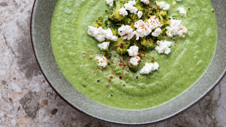 Some brocolli soup with feta on top