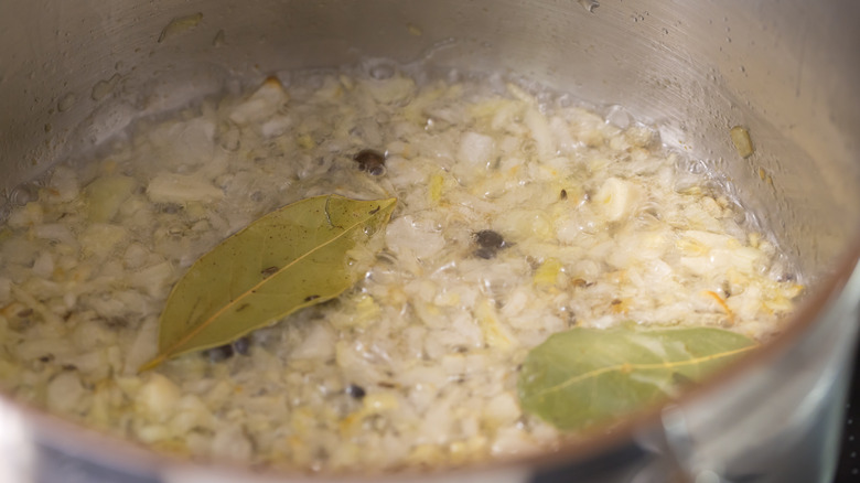 Chopped onions and spices browning in pot