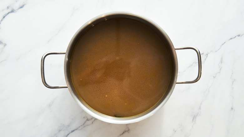 Pot of broth on countertop