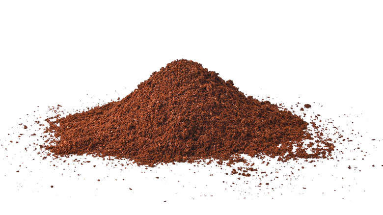 Pile of espresso powder on white background